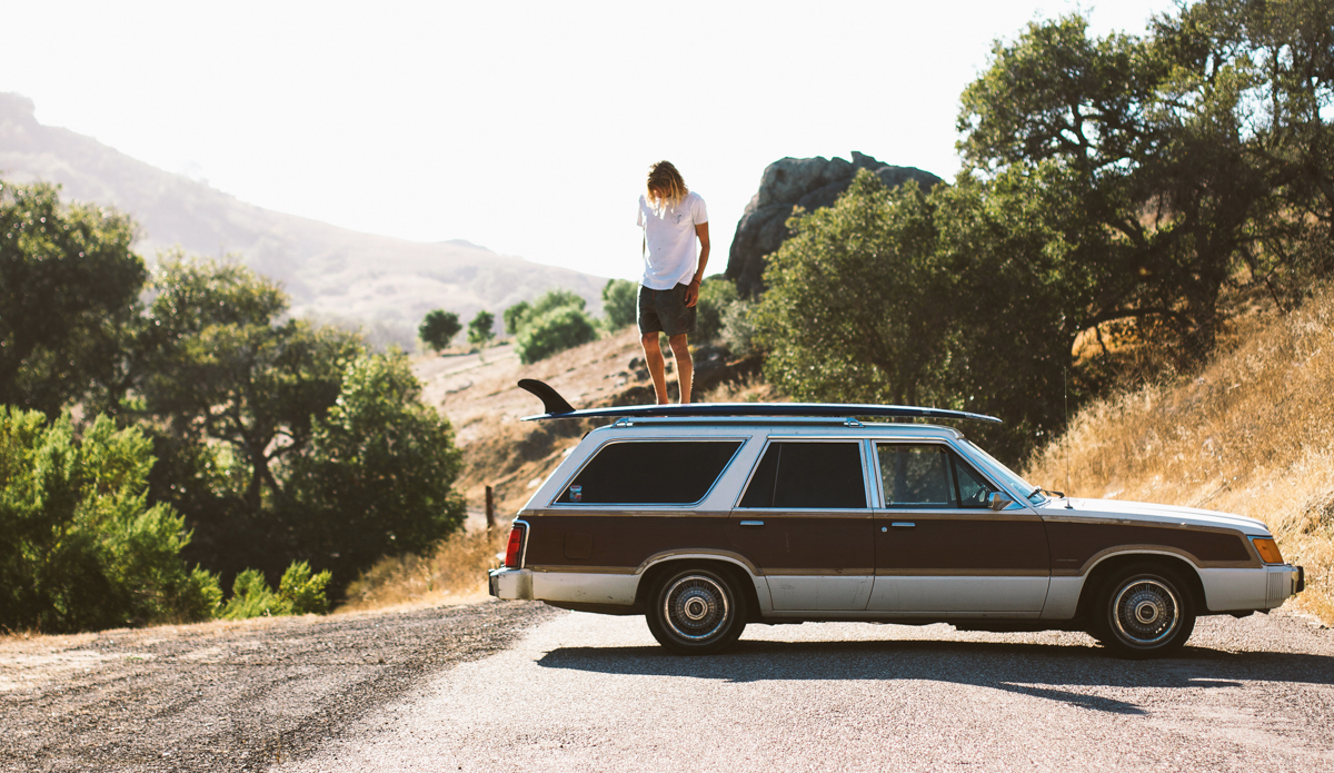 No, he did not drive with his board on top of his car backwards. Snack stop and saving the wax from ruining the luxury interior inside that beauty.  Photo: <a href=\"https://www.colinnearman.com\">ColinNearman.com</a>