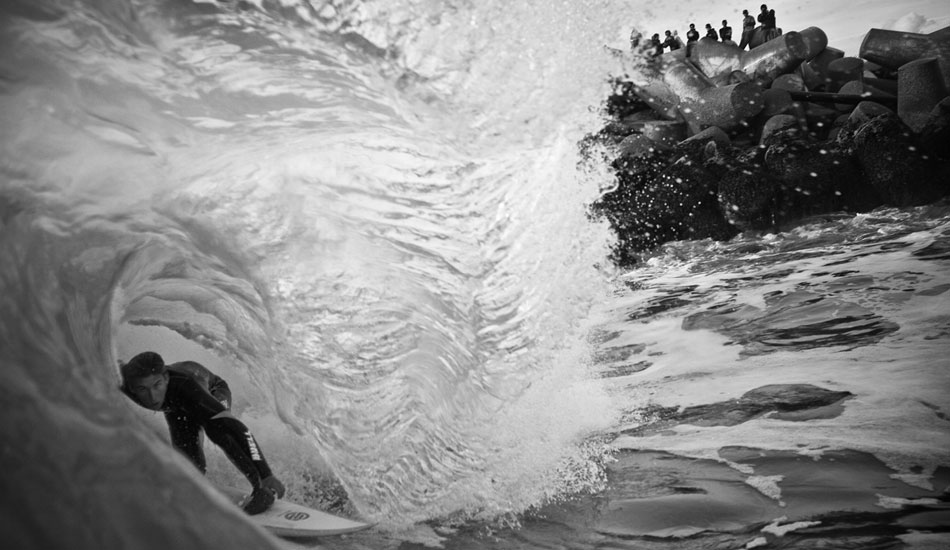 This shot gives a decent perspective of how close the waves at the Harbor mouth break to the jacks.  It\'s also an amazing place to sit back and watch all the action from a mere twenty feet away.  Austin Smith Ford getting a few more before he joins the crew on the jacks. Photo:<a href=\"https://www.ryancraigphotography.com\" target=_blank>Ryan Craig</a>
