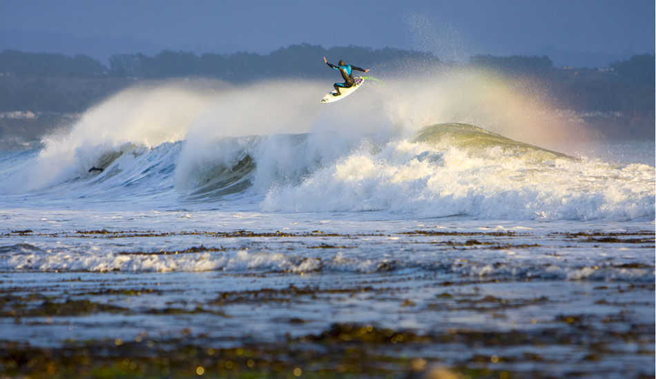 One of my favorite images from home, this is Jesse Colombo with a huge no grab air.  With an exceptionally low tide I was able to frame up a bit more of the break than normal. Photo:<a href=\"https://www.ryancraigphotography.com\" target=_blank>Ryan Craig</a> 