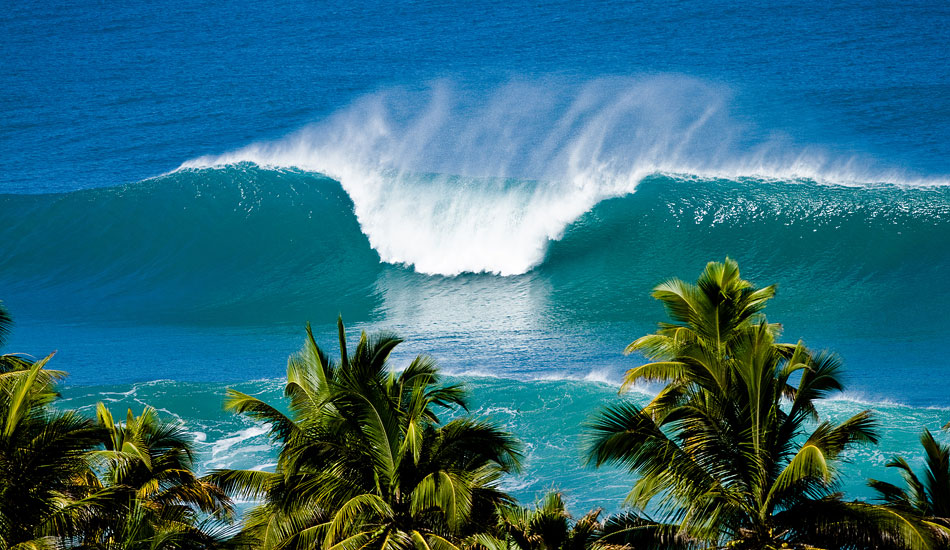 From where this photo was shot, you usually can\'t see any waves at all unless it\'s several feet overhead. Here you see the entire face of the wave. This photo was shot down in Puerto Rico and is actually featured on the cover of the Surfrider Foundation Global Surf Calendar for 2012. Photo: <a href=\"https://reddawnproductions.net/\" target=_blank>Evan Conway</a>.