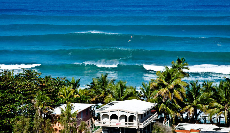 This shot was taken in Puerto Rico. There weren\'t many people making it out into the lineup this morning. Although it does look inviting, those sets approaching out the back landed directly in front of Leif Engstrom and Darren Muschette, the two surfers paddling over the first peak. Photo: <a href=\"https://reddawnproductions.net/\" target=_blank>Evan Conway</a>.