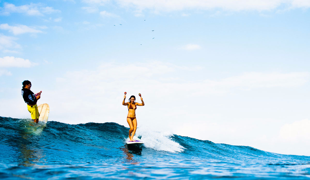 With plenty of fun to small size waves on hand, the team got creative and many a party wave ensued.  Here’s Kassia shaking her Maracas. Photo: Peterson  