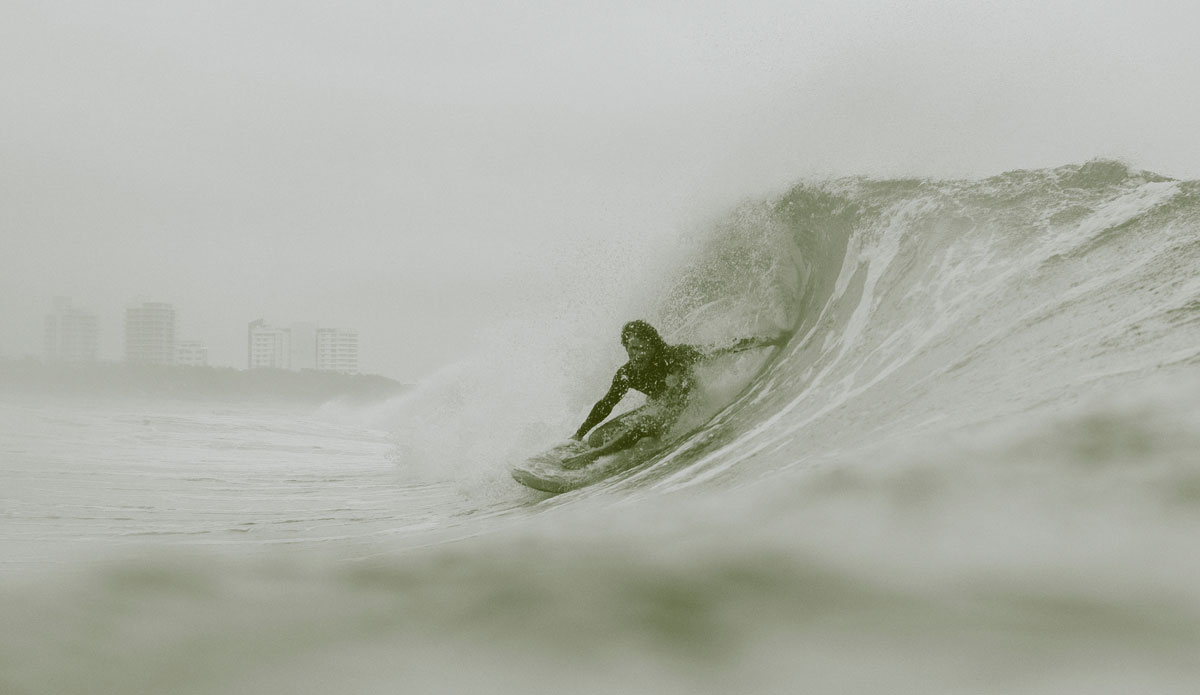 Finding cover from the storm, Mitch Surman. Photo: <a href=\"http://www.instagram.com/rubbedthelamp\"> Warwick Gow</a>