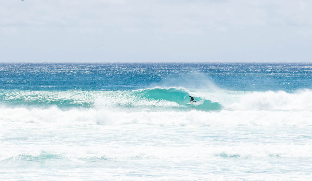 Unknown locked into a screamer. At this angle, he looks like the only one in the water, which couldn\'t be further from the truth. Oh, the camera plays tricks, doesn\'t she? Photo:<a href=\"https://www.instagram.com/brentonderooy/?hl=en\"> Brenton de Rooy</a>