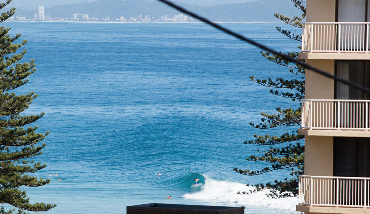 Another wave rolls down the line.