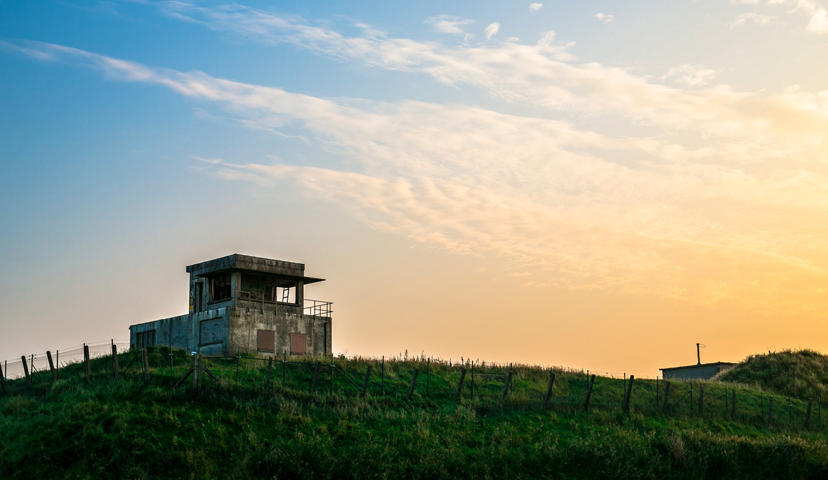 Hitler knew the allied invasion on the Atlantic coast would come eventually, so all along the western edge of Europe — from Spain to Scandanavia — he built a series of fortifications called the Atlantic Wall. In addition to minefields, workers were ordered to build a series of massive concrete bunkers designed to house troops and guns. Decades later, a group of those structures still exist like this one in front of the break in Ostend. Photo: Damian Davila