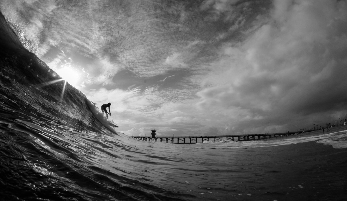 Unknown rider at seal beach during a stormy day with filthy water. Photo: <a href=\"https://instagram.com/danny_nieves\"> Danny Nieves</a>