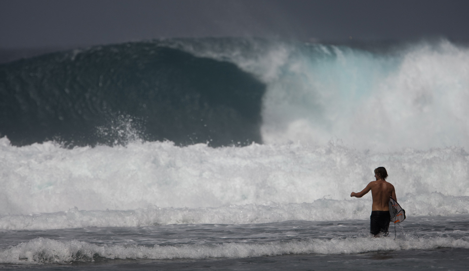 Mainland Sumatra. Depending on the break, the paddle out can be anything from a dry hair cruise through an easy channel to a gnarly mercy dash across surging foam over sharp reef. This surfer is facing the latter situation, and must be patient to avoid a good thrashing. Even then, it is still a possibility. Image: <a href=\"https://www.sparkesphoto.com\" target=\"_blank\">Sparkes</a>
