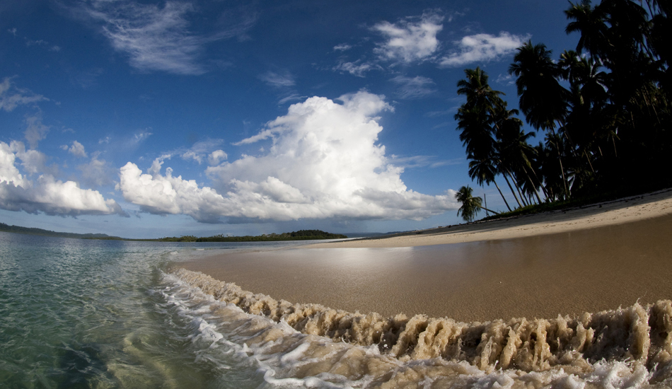 Telos Islands. This beach in the Telos Islands would have to be one of the most stunning I\'ve ever seen. Many surfers travel there with their girlfriends, as the beautiful beach charms the girls and helps a surfer\'s chances of a leave pass to some of the great waves in the area! Image: <a href=\"https://www.sparkesphoto.com\" target=\"_blank\">Sparkes</a>
