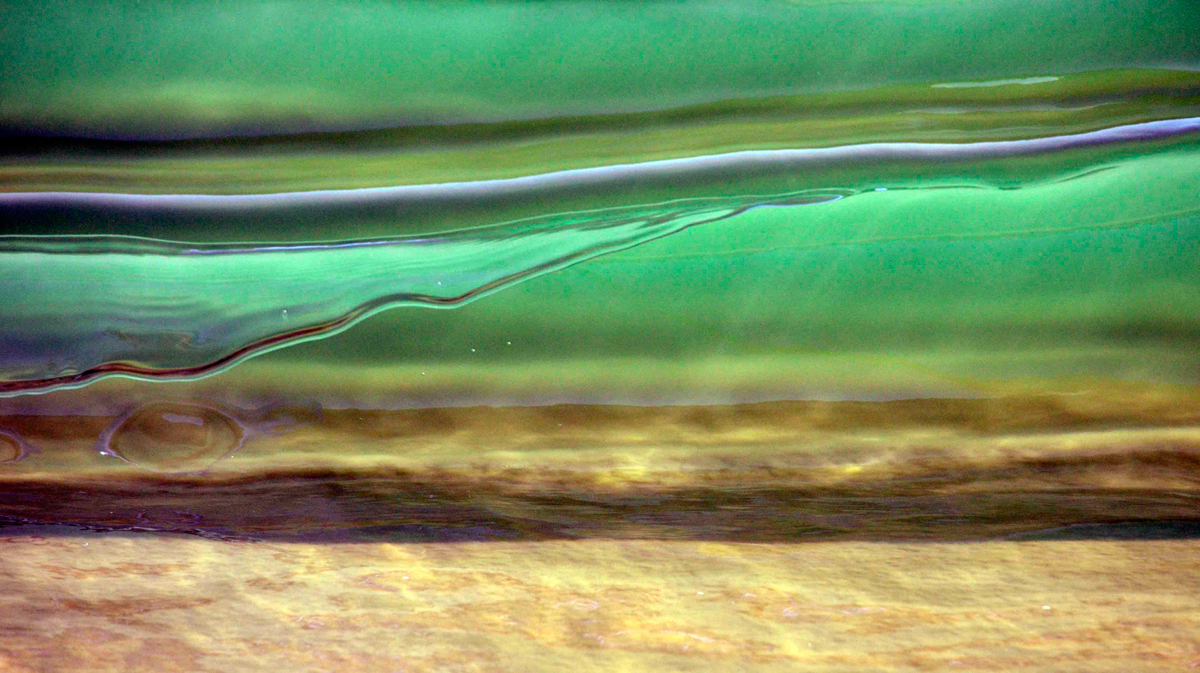 The beauty of looking through the belly of an eight inch wave. Photo: <a href=\"https://debmwaveart.webs.com/\">Deb Morris</a>