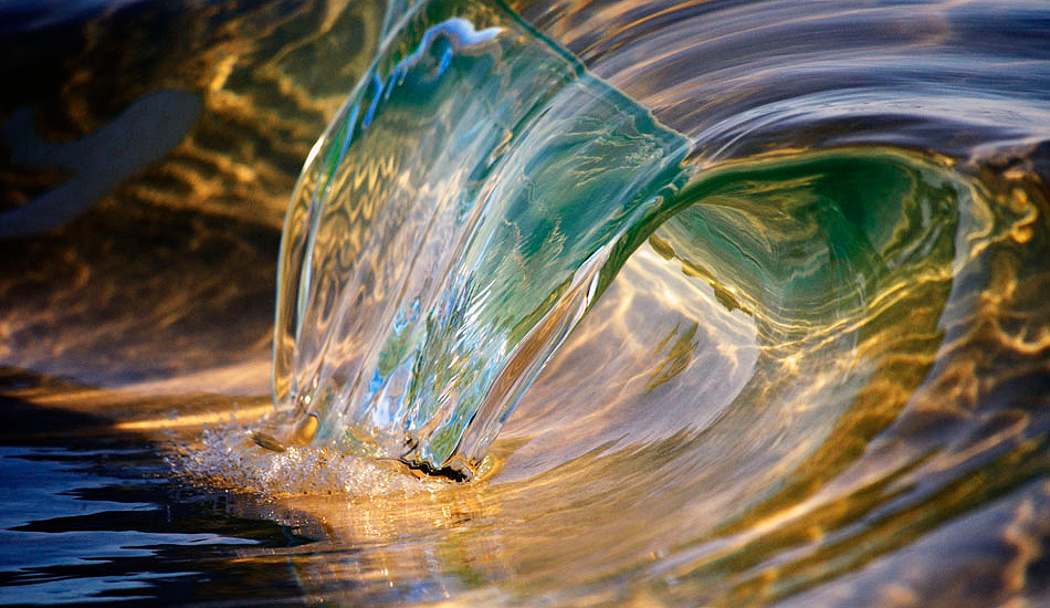 5cm of molten glass rolling over on the foreshore. Photo: <a href=\"https://www.debmwaveart.webs.com/\" target=_blank>Deb Morris</a>.