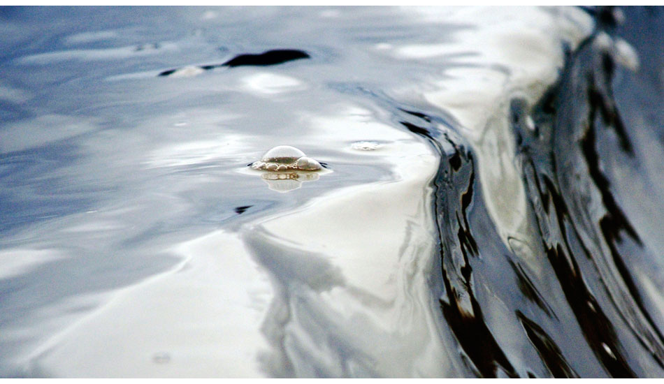 The sun skimming the top of the water gave the illusion of molten silver with bubbles floating over the falls. Photo: <a href=\"https://www.debmwaveart.webs.com/\" target=_blank>Deb Morris</a>.