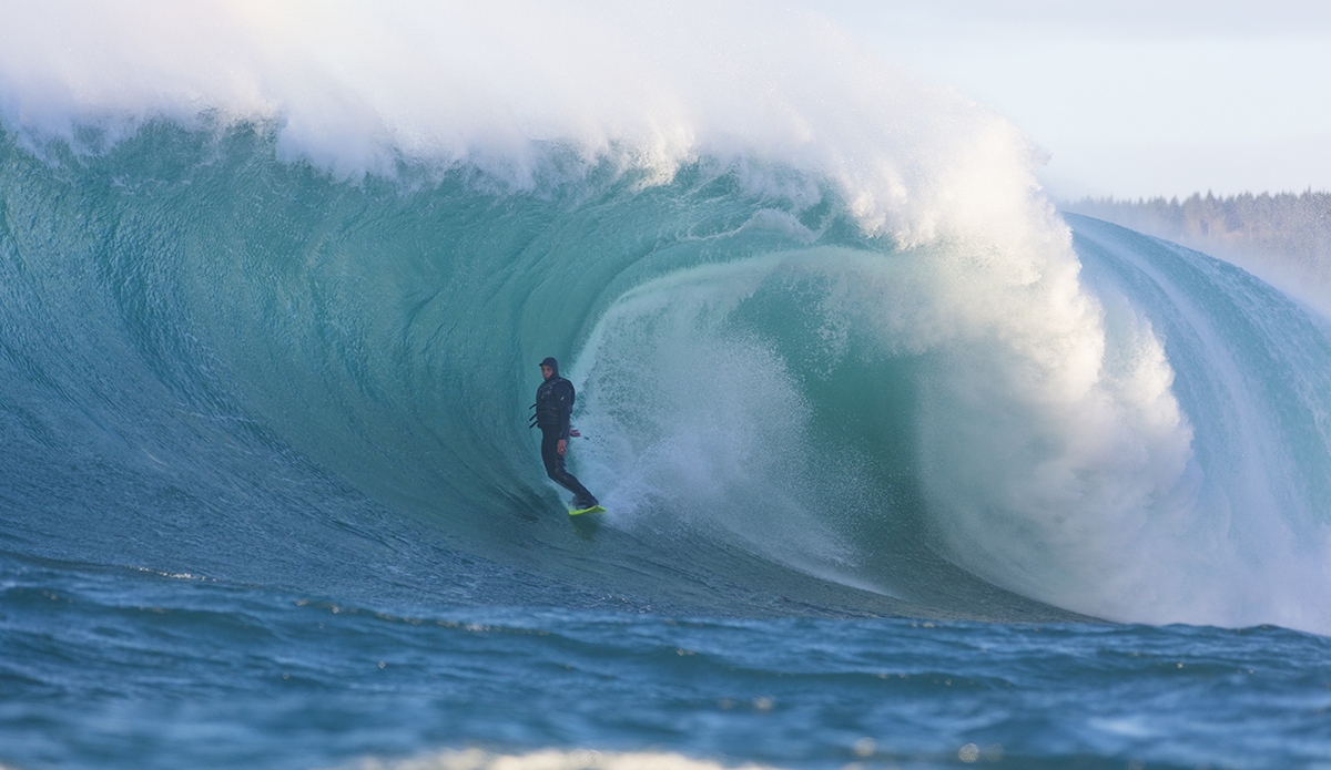 Nat Parsons rides a big wave at a remote reefbreak near Dunedin, New Zealand. Photo: Derek Morrison