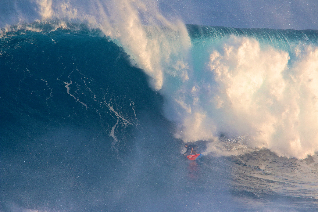 Billy Kemper coming off the bottom putting it on the rail on a big one. The equipment is progressing and shapers are figuring out how to make big guns work in giant surf.