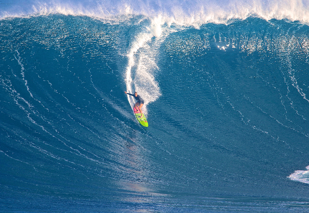 Maui girl Paige Alms. One of the 1st girls to surf Peahi riding her boyfriends hand shaped SOS surfboards. Sean shapes guns for a lot of the surfers out there and Peahi is his backyard.