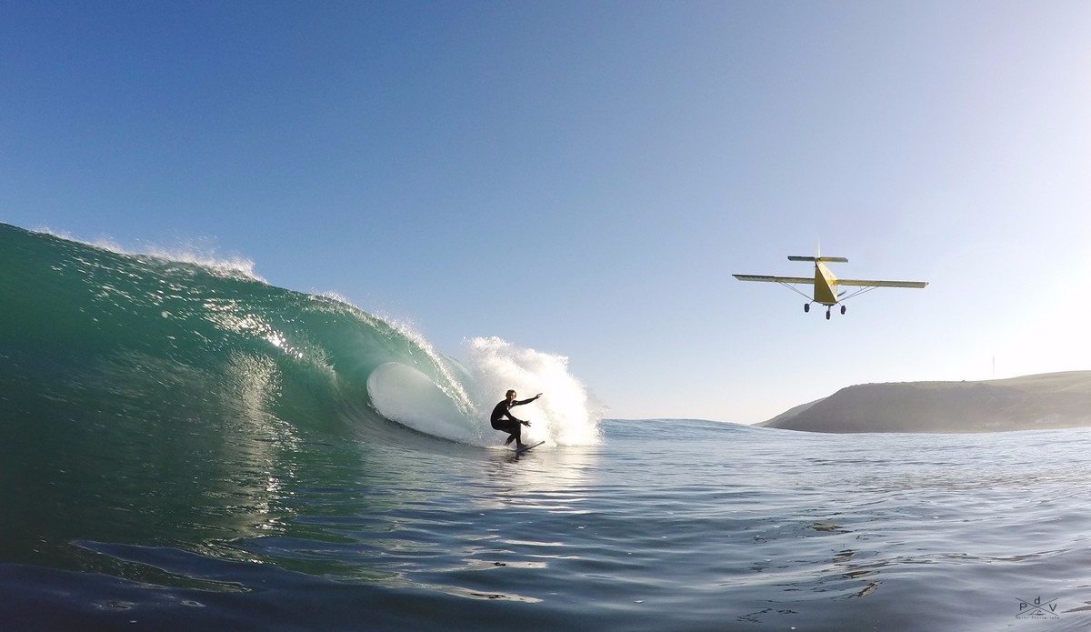 Simon Fish maintains his composure as a low flying plane gets within a couple of meters. This is one of my favorite images and is truly a once in a lifetime shot. Photo: Pierre de Villiers