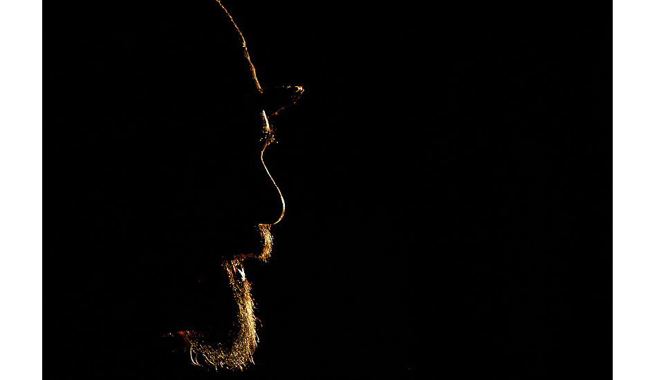 Maurice Cole. This was shot in his shaping bay with the natural bush light pouring in late in the afternoon. It hit him just right creating this silhouette. Photo: <a href=\"https://edsloanephoto.com/\">Ed Sloane</a>