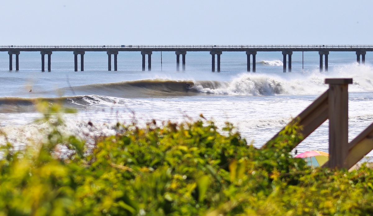 Virginia Beach\'s Shaun Devine drives away from the pier and into the zone. Photo: <a href=\"https://jettylife.com/\">John Streit.</a>