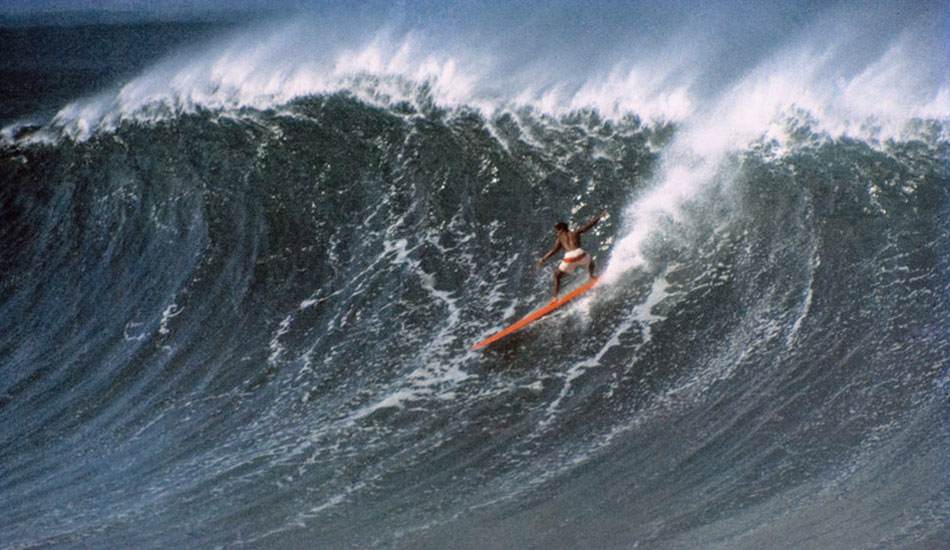 Always positioned way-behind-the-peak this mid-morning north easterly vantage of Eddie Aikau dropping into another long Waimea wall captures his hunger for challenge in the lineup, December 22, 1967. Photo: Tim McCullough