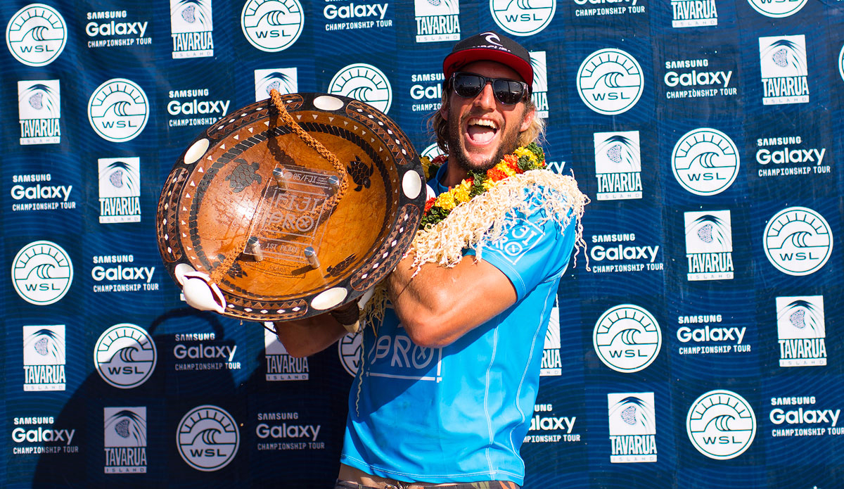 Owen Wright hoists the Fiji Pro trophy. Photo: <a href=\"https://www.worldsurfleague.com/\">WSL/<a href=\"https://instagram.com/kirstinscholtz/\">Kirstin Scholtz</a>