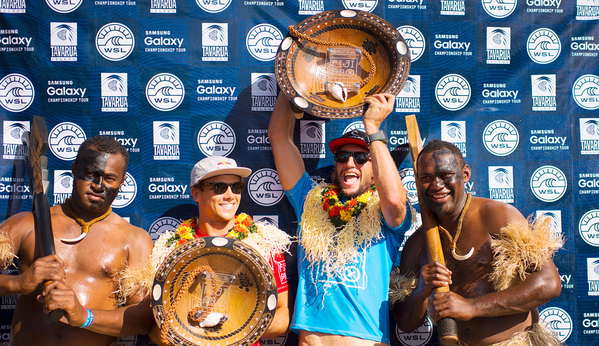 Julian Wilson of Coolumn, Australia (pictured left) Runner Up at the Fiji Pro and Owen Wright of South Coast, NSW, Australia (pictured right) Winner of the FIji Pro celebrate during Prizegiving on Tavarua on Tuesday June 16, 2015. Photo: <a href=\"https://www.worldsurfleague.com/\">WSL/<a href=\"https://instagram.com/kirstinscholtz/\">Kirstin Scholtz</a>
