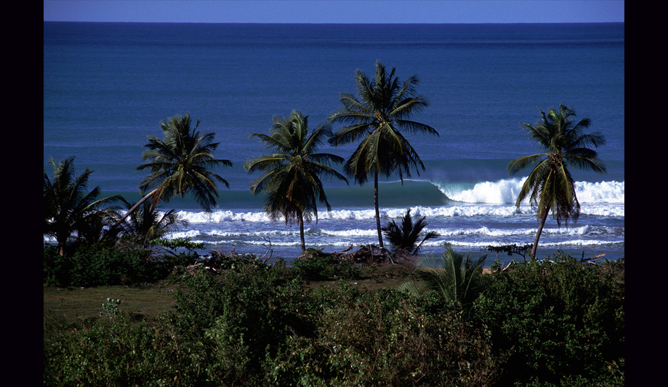 April 1993 - On a desolate stretch of Puerto Rico\'s north coast this beachbreak wave reels off in the company of very few people.  A 45-minute hike through an often muddy cow pasture keeps the faint of heart away, the sand clean of rubbish, and the waves free of too many takers. Image: <a href=\"https://stevefitzpatrick.com/\" target=\"_blank\">Fitzpatrick</a>  
