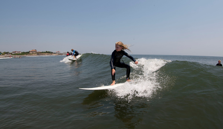 Here\'s Summa Love Camper Emily, on the same wave as Tom Petriken. Image: <a href=\"https://mikeincitti.com/\" target=\"_blank\">Incitti</a>/<a href=\"https://summalove.com/\" target=\"_blank\">Summa Love</a>