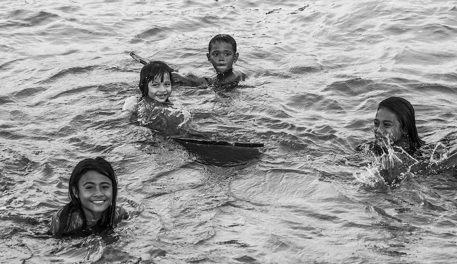 Local girls learn to surf in remote Indonesia, 2018. Photo: Fran Miller