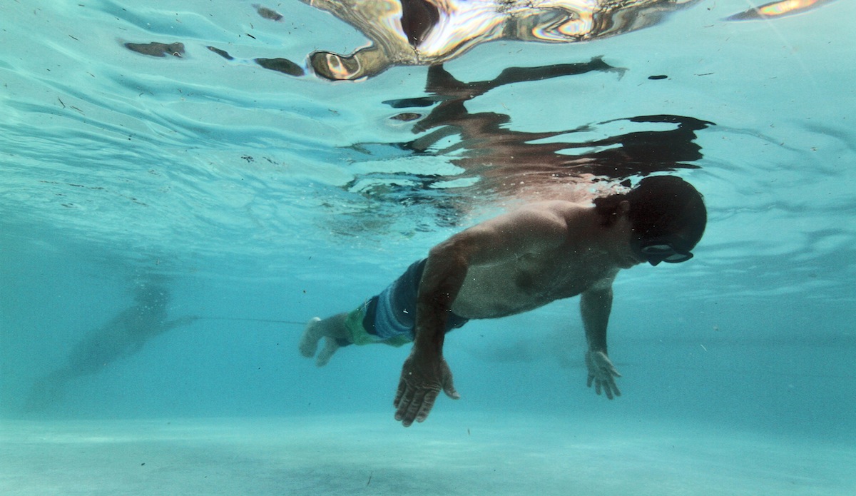 Stuck in a big wave hold down, you have to be able to pull the weight of your board, and then some. So, try pulling your partner across the 20 meter pool, on a single breath, while he’s attached to your ankle by your leash. Photo: <a href=\"https://instagram.com/el_squid\">Anthony Dooley</a>