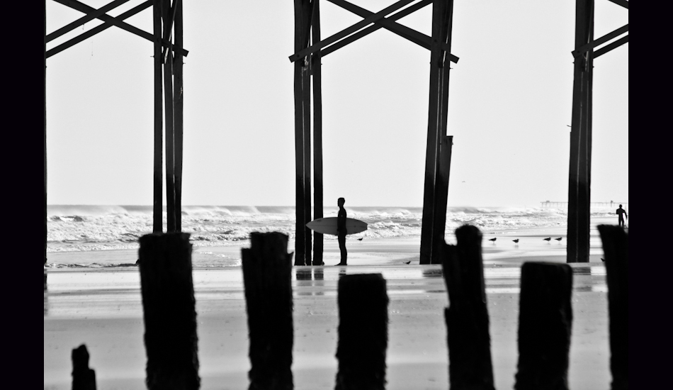 Carolina Beach, NC, 2011. A lonesome surfer paddles out to catch swell at a local spot called \"Sunskipper\". Photo: <a href=\"http://www.chrisfrickphotography.com/\" target=_blank>Chris Frick</a>

