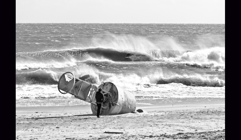 S Turns. OBX, NC 2011. Charlie Weatherby tucked into a drainer. Since Hurricane Sandy, this spot no longer exists. Photo: <a href=\"http://www.chrisfrickphotography.com/\" target=_blank>Chris Frick</a>
