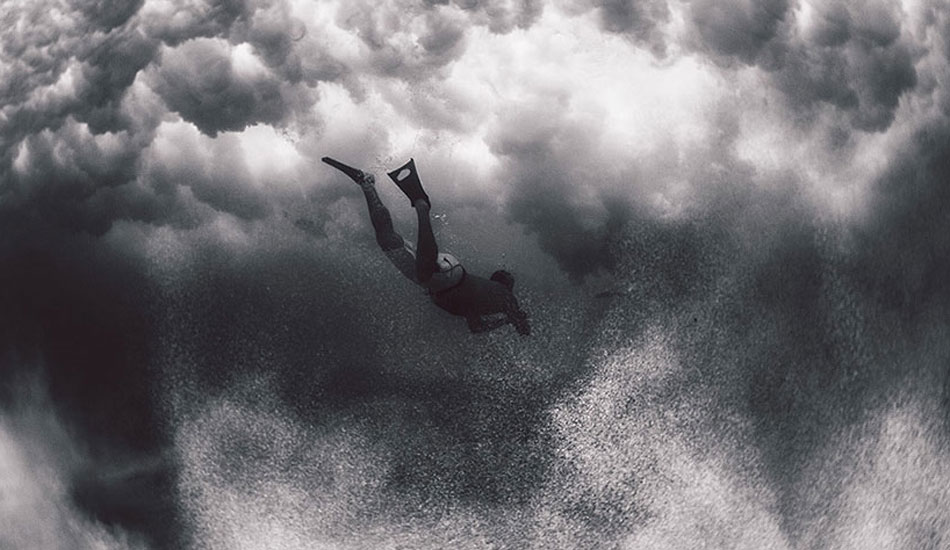 Unknown swimmer diving under the clouds at Makapu\'u. Photo: <a href=\"https://www.gagehingeley.com/\" target=_blank>Gage Hingeley</a>.