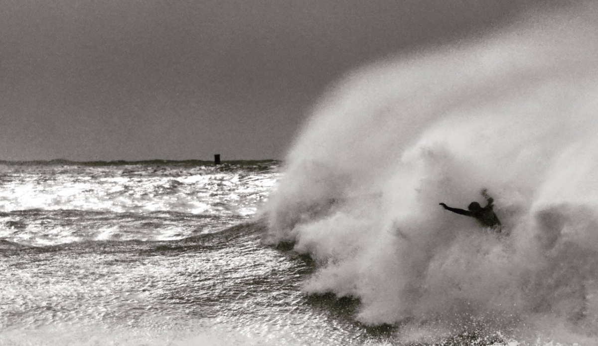 Triple overhead and the surfer got up too high and lost the drive. The wave overcame him in 1/2 second. One minute he was there and the next, completely swallowed by the foam ball - it happened so fast it didn’t seem real.Photo: Christopher Gauthier

