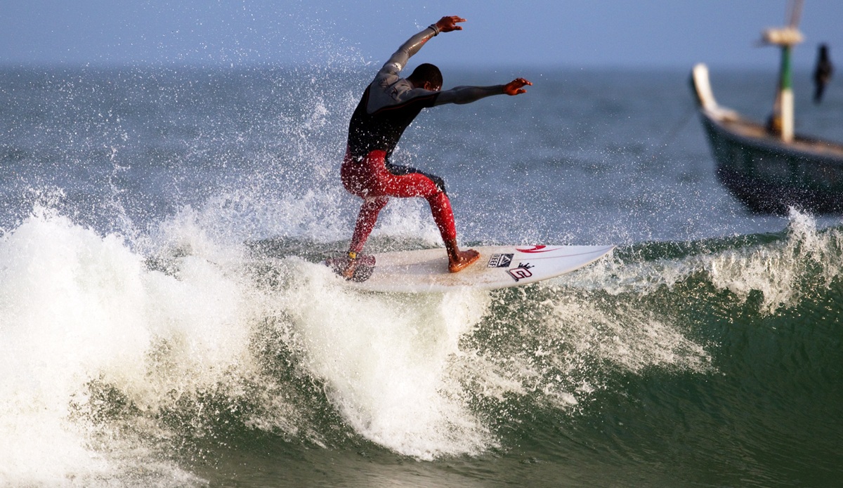 Local surfer Kofi floating the beach break at Busua. Photo: <a href=\"https://www.gregewingphoto.com/\"> Greg Ewing</a>