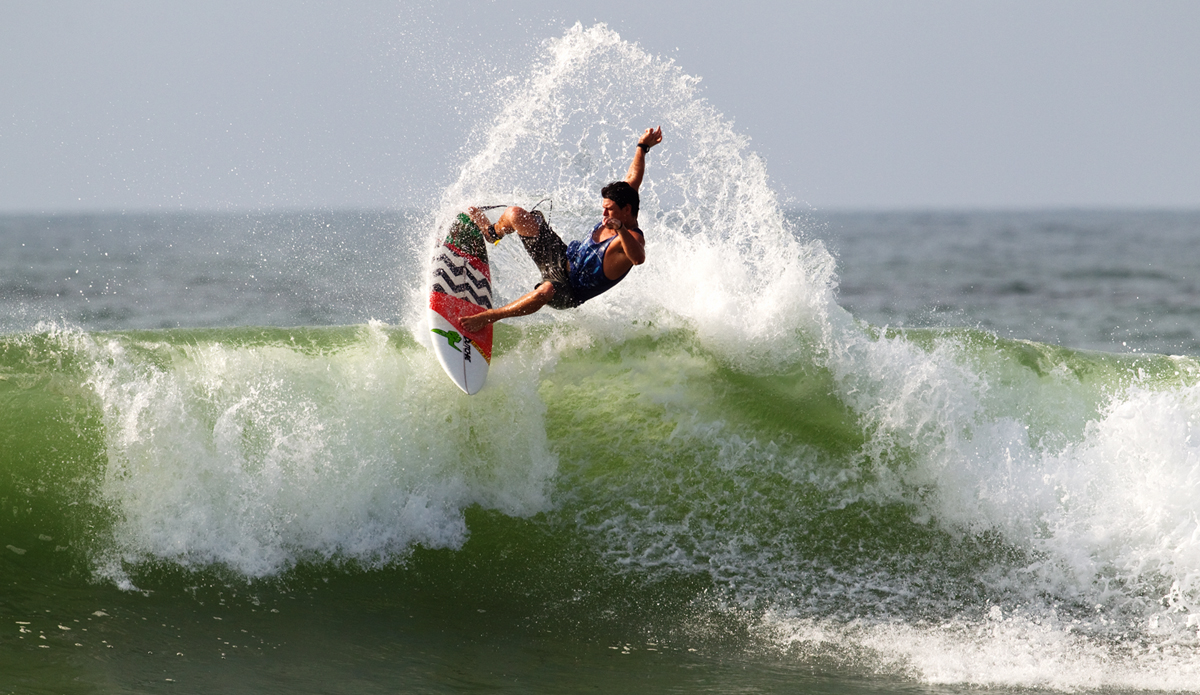 John popping the fins and Black Mamba, one of the best, if not the best wave in Ghana.  Photo: <a href=\"https://www.gregewingphoto.com/\"> Greg Ewing</a>