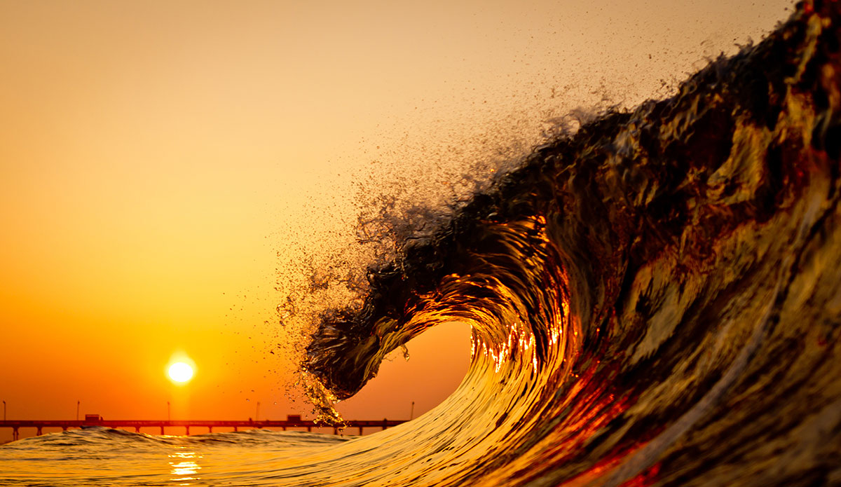The sun and the surf meet twice a day.  I’ve made it a habit to at least catch one meeting a day. Photo: <a href=\"https://www.surferphotos.com/\">Graham Hunt</a>