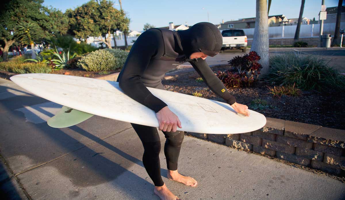 ​Alex Swanson about to surf the (surprisingly) cold waters of Newport on his John Wesley Twin Fin Pin. Photo: Gregory Swanson