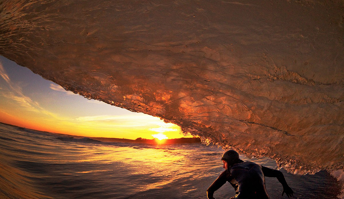 Luring glass funnels in the sunset. An image of pure beauty. What lies beneath these slabs is hidden to the eyes of many. Beyond picture-perfection, we struggle with a vicious little demon that wants to flatten us hard on the reef below. It warns us with its gurgling bubbles. This is an image that captures the still moment of what was an intense hour of a few men chasing gold. Photo: Al Mackinnon (@almackinnon)