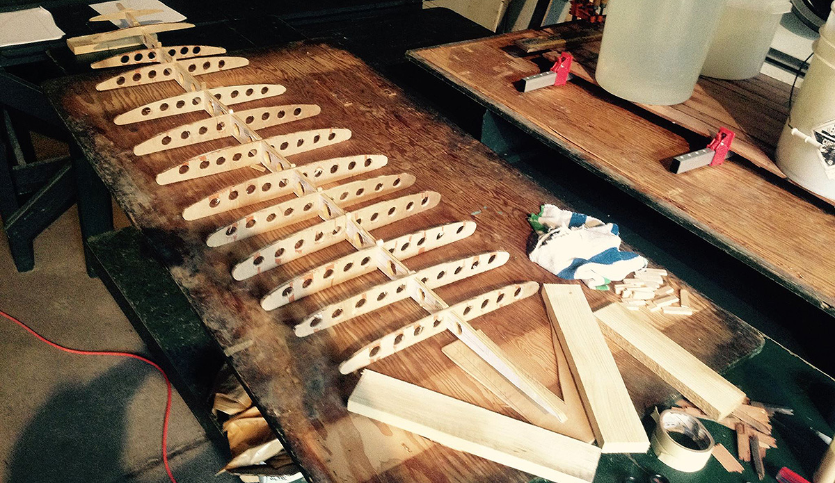 Meanwhile, the shape of the board comes from these ribs, cut from a template downloaded off the Web, printed to paper and glued to a plywood board. It\'s not easy to find free, effective templates. Your best bet is to buy one, from about $100, from pros such as www.grainsurfboards.com . I had to modify and tweak the downloaded design here, aiming for a 6\'2\'\' single-fin that\'s very wide at 22\'\', for easy paddling and stability.