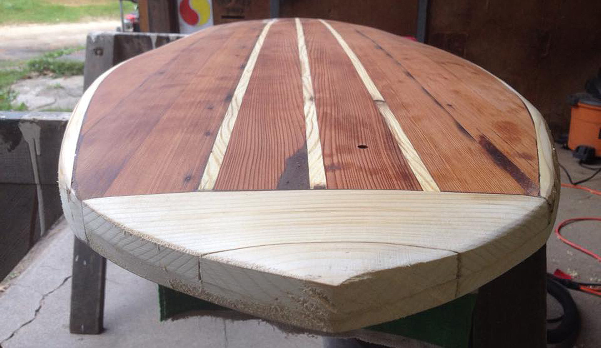 Before shaping the nose. The small hole in the deck allows for a screw-in plug later, necessary to vent air from the hollow core after each surf. Air trapped inside the board expands with heat, creating pressure.