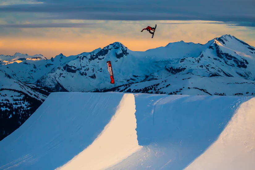 Mikey Ciccarelli jumping into the sunset with the Canada Snowboard Team at Whistler Blackcomb.