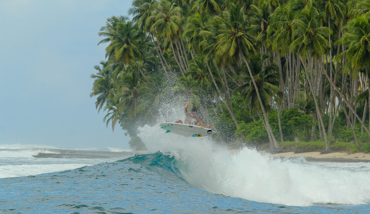 On this wave, I learned to never take the first wave of the set. After a round-house I set my rail and committed to this turn. I had to straighten out and \'pancaked it\' on to shallow water. After this wave there were 7 more behind it increasing in size, and I took all of them on the head. After each wave I got pushed closer and closer to shore, where soon I would be on dry reef. I managed to get back out without any cuts, but I was pushed all the way from the point, to where our boat was anchored. Photo: Courtesy of Hunter Jones
