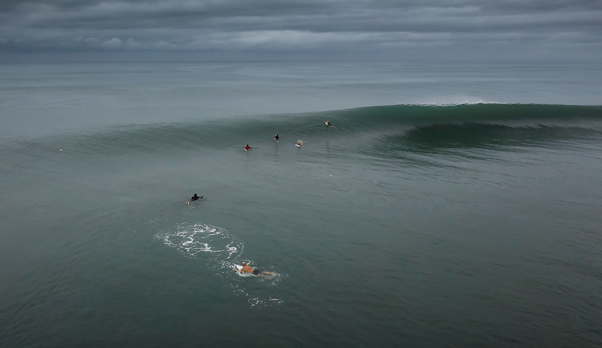 “I believe in shooting the weather. This was a moody day of absolute perfection at Keramas. And to see that wave so uncrowded really lets a photographer capture the magic of that reef. The lack of crowds this year has given us all a chance to see the waves again as they are. And there is feeling of plenty to go around. That monsoon squall on the horizon moved in a half-hour later, obliterating a dream session.”