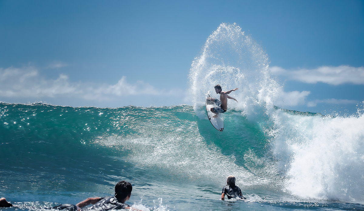 “From the water, sometimes I like to pull back and give it that paddling perspective. With guys in the foreground you really get the feeling that you’re scratching over a set while some guy rips by. You’re stoked, inspired really. Rio Waida can be that kind of inspiration. Hottest guy on the island of Bali right now and taking a shot internationally too.”