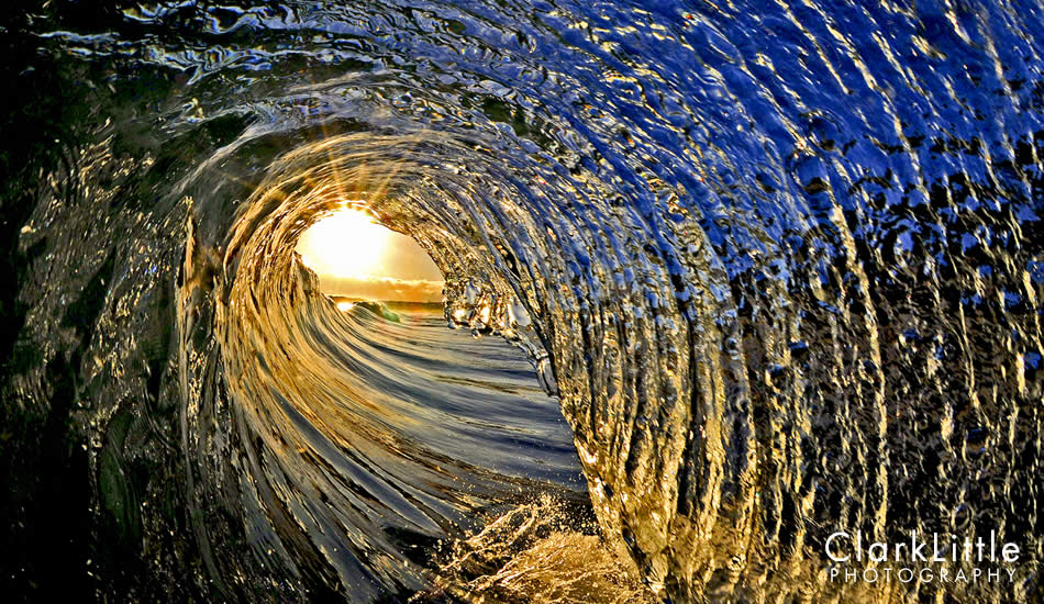 When a slight breeze hits the wave on ultra glassy mornings, it cuts facets into the wave surface creating a sunrise jewel. Photo: <a href=\"https://ClarkLittlePhotography.com\" target=_blank>Clark Little</a>.