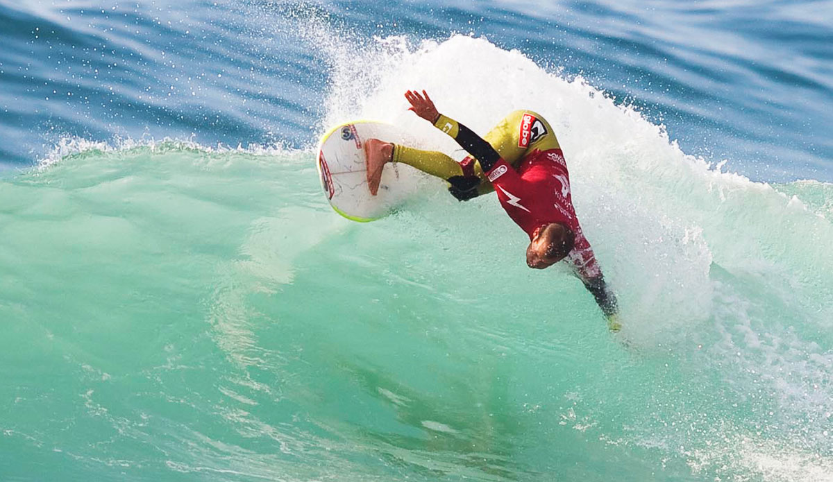 In ’08 Florida journeyman CJ Hobgood took gold at the World Surfing Games. He’s the only surfer on the 2014 ASP World Tour that owns both ISA and ASP world titles. Ever the team player, Hobgood remarked, “It would have been the ultimate to win a team gold, but we had the second best team and it was all good. It was a sick team (including Ben Bourgeoise, Dillon Perrillo, and Nat Young) and everyone got along so good. Everyone laid it all out there and that’s how the cards fell.” Photo courtesy of <a href=\"https://www.isasurf.org/\">ISA Archive</a>