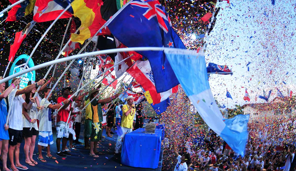 A gathering of surfing nations, the Opening Ceremony for any ISA World Championship is a spectacle to behold. ISA President Fernando Aguerre (pictured) declaring the event officially open, after all nations have poured their sands in the Sands of the World Ceremony, symbolizing the peaceful union of the world through surfing. Photo courtesy of <a href=\"https://www.isasurf.org/\">ISA Archive</a>