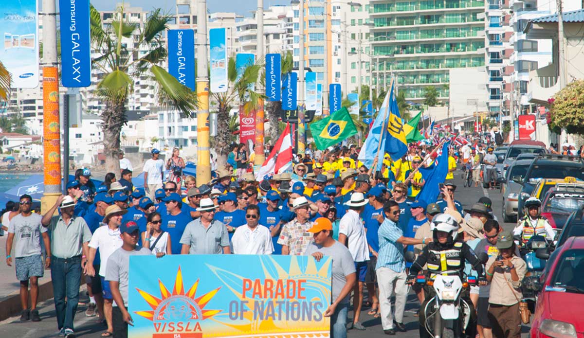 The ISA\'s Parade of Nations marches through the city streets. Photo: <a href=\"https://www.isasurf.org/\">ISA | Rommel</a>