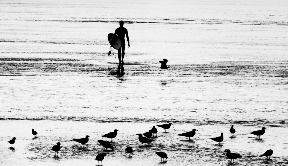 David Lopez coming out of the water at his local beachbreak in Gijon. Autumn, 2008. Photo: <a href=\"https://www.jaiderlozano.com/\" target=_blank>Jaider Lozano</a>
