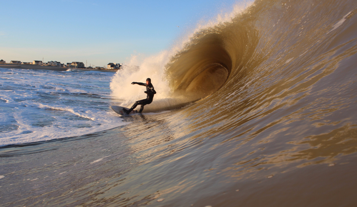 My best buddy, Justin Parr, charging at the Cape Hatteras Lighthouse. Justin and I get along because we push each other every time we get in the water. Photo: <a href=\"https://instagram.com/zlottyphoto/\">Jake Zlotnick</a>
